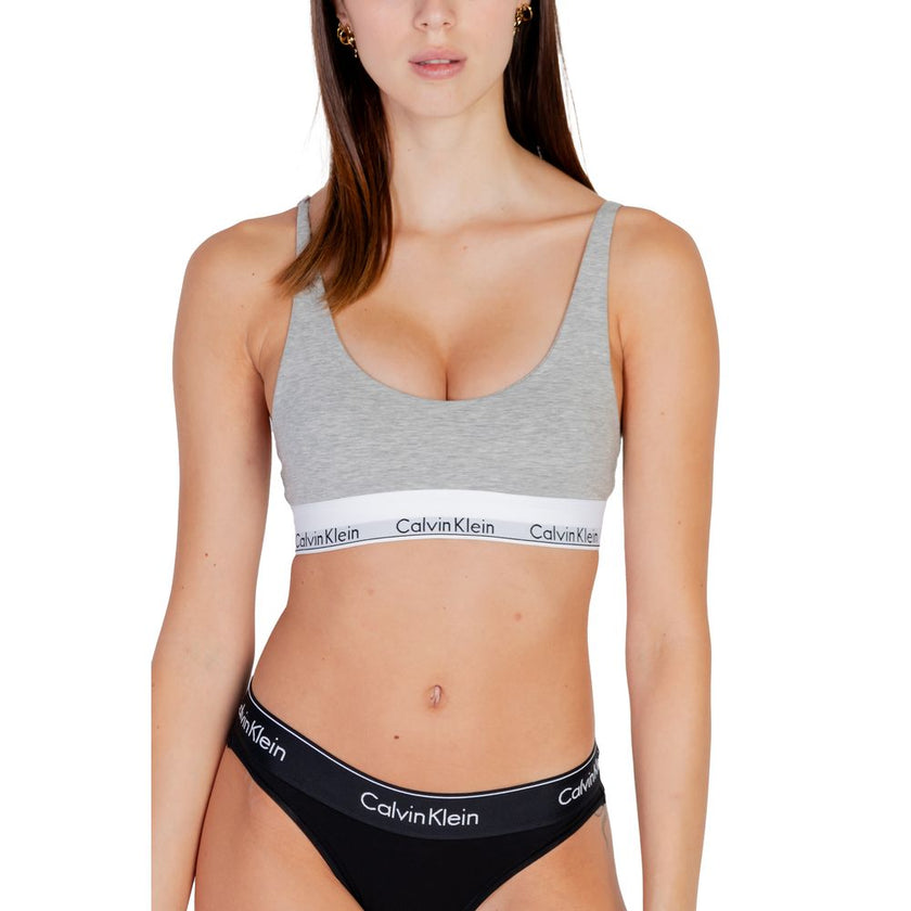 Gray Cotton BraDiscover the lightly lined bralette by Calvin Klein Underwear, an essential piece for your intimate wardrobe. Made with high-quality materials, this bralette consists of 53% cotton, 35% modal, and 12% elastane/lycra, ensuring a comfortable