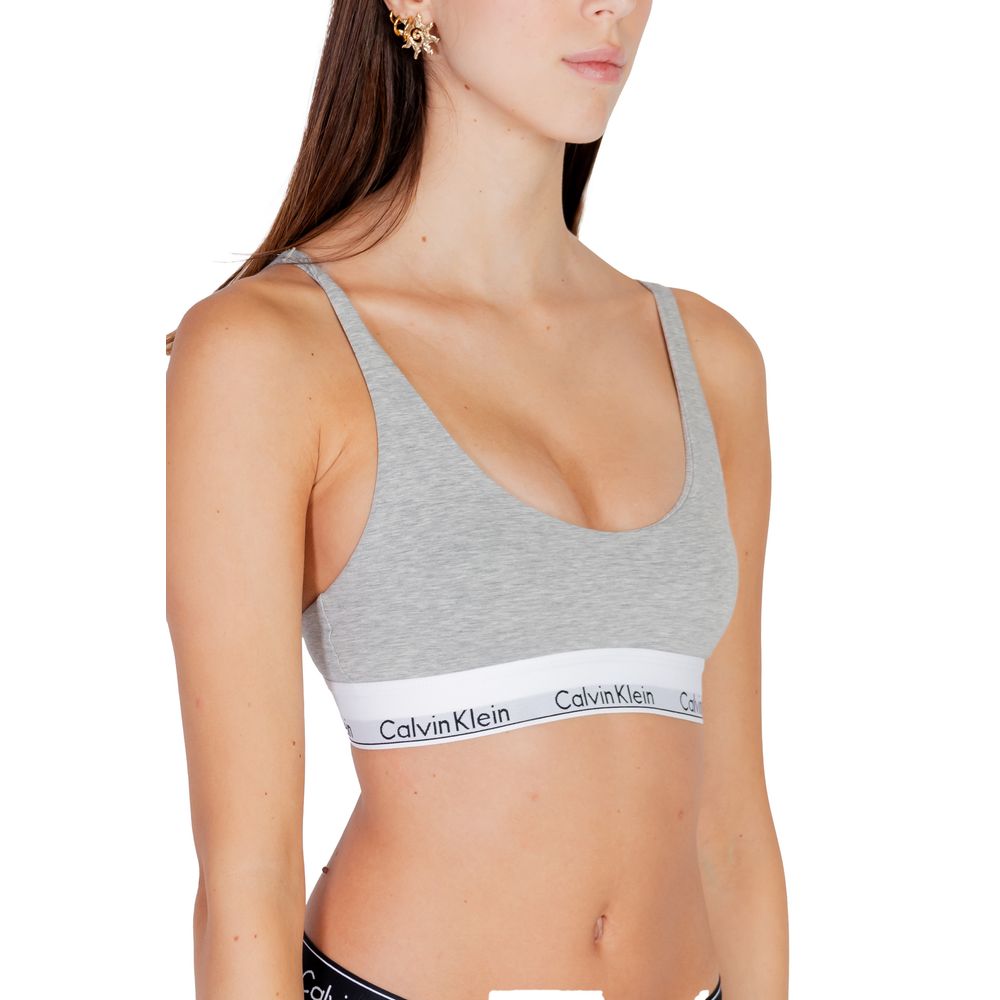 Gray Cotton BraDiscover the lightly lined bralette by Calvin Klein Underwear, an essential piece for your intimate wardrobe. Made with high-quality materials, this bralette consists of 53% cotton, 35% modal, and 12% elastane/lycra, ensuring a comfortable