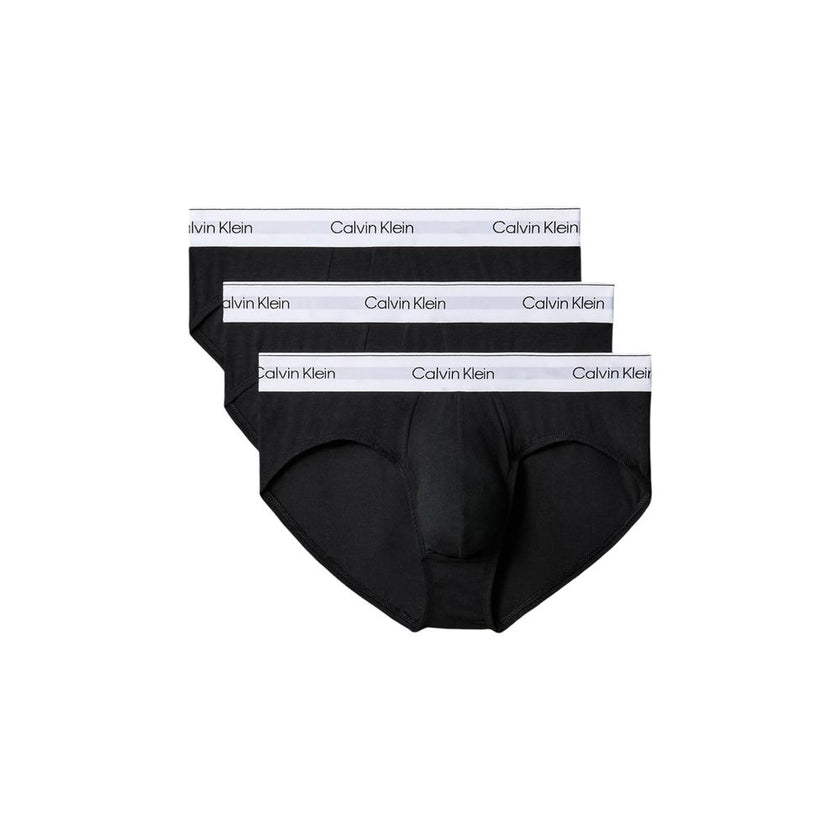 Black Cotton BriefsDiscover the timeless comfort and style of the Calvin Klein Underwear HIP BRIEF men’s briefs in a pack of 3. Made from high-quality materials, featuring 95% cotton and 5% elastane/lycra, these briefs provide a perfect fit and a soft fee