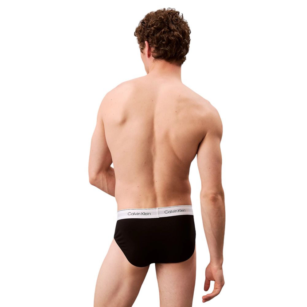 Black Cotton BriefsDiscover the timeless comfort and style of the Calvin Klein Underwear HIP BRIEF men’s briefs in a pack of 3. Made from high-quality materials, featuring 95% cotton and 5% elastane/lycra, these briefs provide a perfect fit and a soft fee