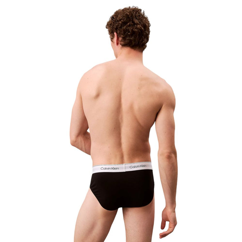 Black Cotton BriefsDiscover the timeless comfort and style of the Calvin Klein Underwear HIP BRIEF men’s briefs in a pack of 3. Made from high-quality materials, featuring 95% cotton and 5% elastane/lycra, these briefs provide a perfect fit and a soft fee