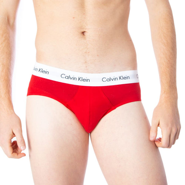 Red Cotton BriefsDiscover the comfort and timeless style of the Calvin Klein Underwear 3 Hip Brief U2661G men’s briefs. Made from a blend of 95% cotton and 5% stretch, these briefs provide a perfect fit and a soft feel against the skin. The elastic waistb