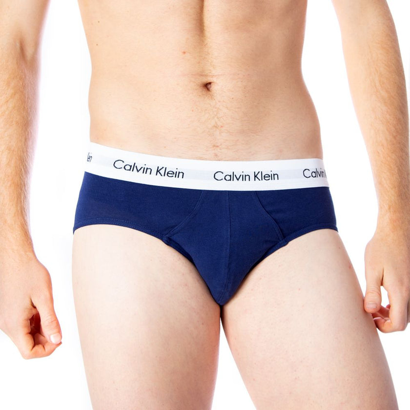 Red Cotton BriefsDiscover the comfort and timeless style of the Calvin Klein Underwear 3 Hip Brief U2661G men’s briefs. Made from a blend of 95% cotton and 5% stretch, these briefs provide a perfect fit and a soft feel against the skin. The elastic waistb