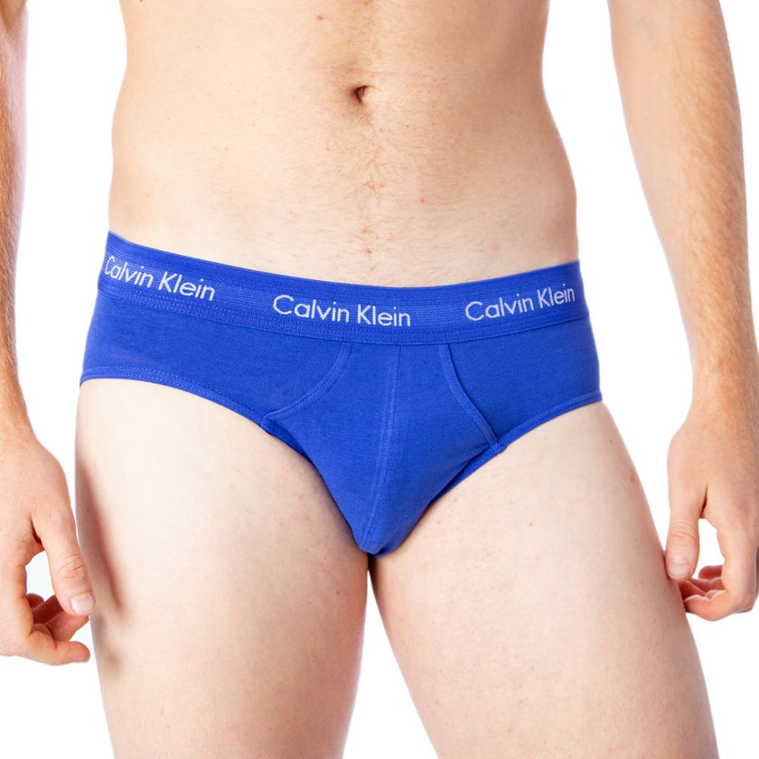 Blue Cotton BriefsDiscover the comfort and timeless style of the Calvin Klein Underwear 3 Hip Brief U2661G men’s briefs. Made from a blend of 95% cotton and 5% stretch, these briefs provide a perfect fit and a soft feel against the skin. The elastic waist