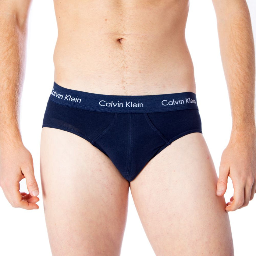 Blue Cotton BriefsDiscover the comfort and timeless style of the Calvin Klein Underwear 3 Hip Brief U2661G men’s briefs. Made from a blend of 95% cotton and 5% stretch, these briefs provide a perfect fit and a soft feel against the skin. The elastic waist