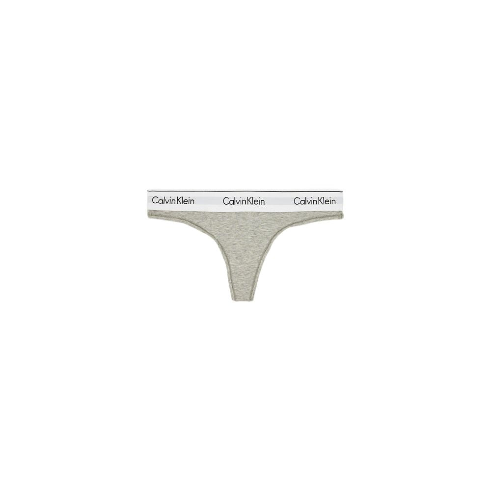 Gray Cotton PantieDiscover timeless comfort and style with the Calvin Klein Underwear THONG F3786E. Made from a high-quality blend of 53% cotton, 35% Modal, and 12% elastane, this thong is designed to provide a perfect fit and a soft feel against the skin