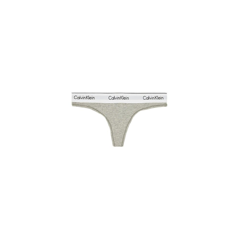 Gray Cotton PantieDiscover timeless comfort and style with the Calvin Klein Underwear THONG F3786E. Made from a high-quality blend of 53% cotton, 35% Modal, and 12% elastane, this thong is designed to provide a perfect fit and a soft feel against the skin