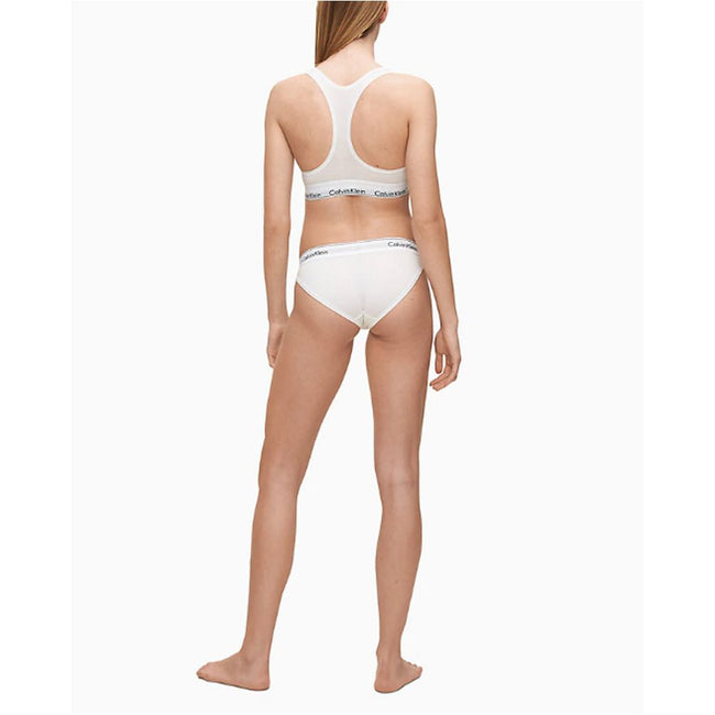 White Cotton PantieDiscover the ultimate comfort and style with the Calvin Klein Underwear BIKINI F3787E women’s briefs and thong. Made from a high-quality blend of 53% cotton, 35% modal, and 12% elastane, these pieces offer a soft and snug fit. The minim