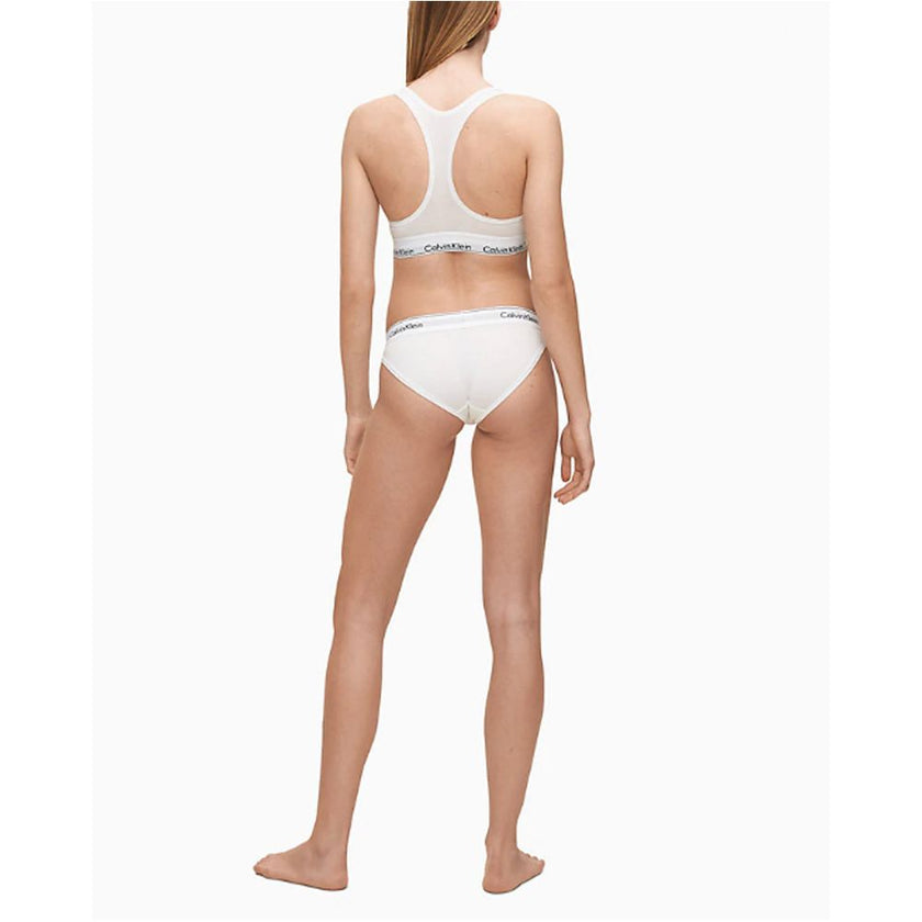 White Cotton PantieDiscover the ultimate comfort and style with the Calvin Klein Underwear BIKINI F3787E women’s briefs and thong. Made from a high-quality blend of 53% cotton, 35% modal, and 12% elastane, these pieces offer a soft and snug fit. The minim