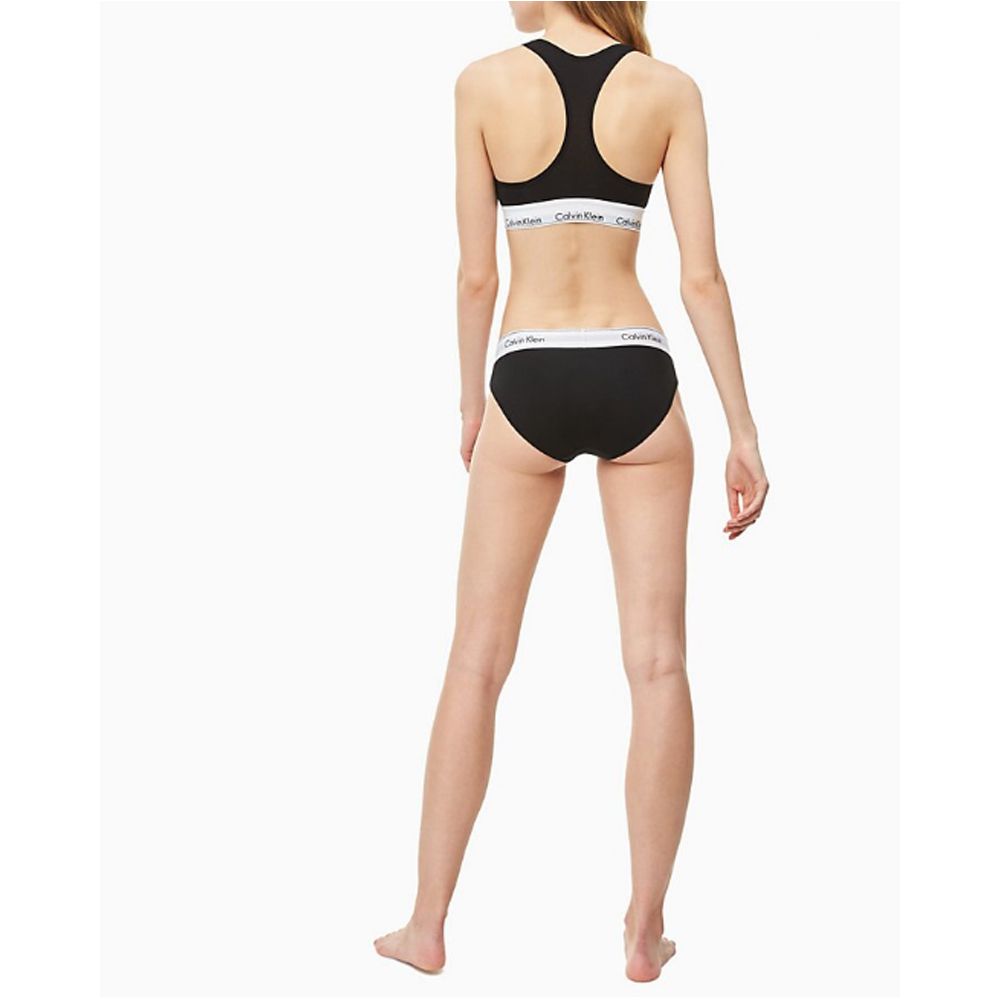 Black Cotton PantieDiscover the ultimate comfort and style with the Calvin Klein Underwear BIKINI F3787E women’s briefs and thong. Made from a high-quality blend of 53% cotton, 35% modal, and 12% elastane, these pieces offer a soft and snug fit. The minim