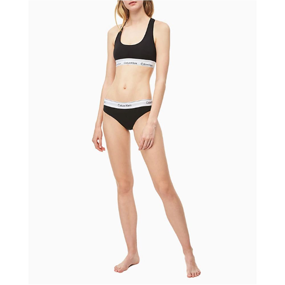 Black Cotton PantieDiscover the ultimate comfort and style with the Calvin Klein Underwear BIKINI F3787E women’s briefs and thong. Made from a high-quality blend of 53% cotton, 35% modal, and 12% elastane, these pieces offer a soft and snug fit. The minim