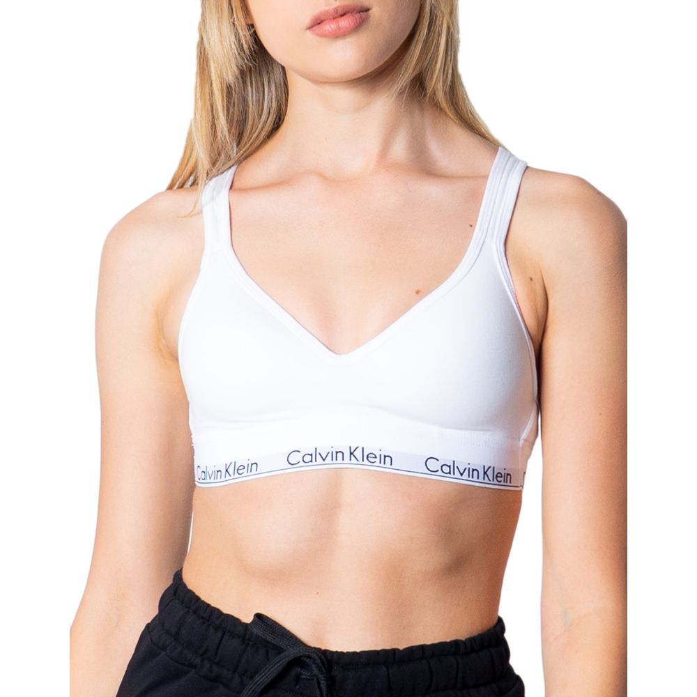 White Polyester BraDiscover the Lift bralette by Calvin Klein Underwear, an essential piece for your intimate wardrobe. Made from 100% polyester, this bra is designed to provide comfort and support throughout the day. Its bralette shape is perfect for a c