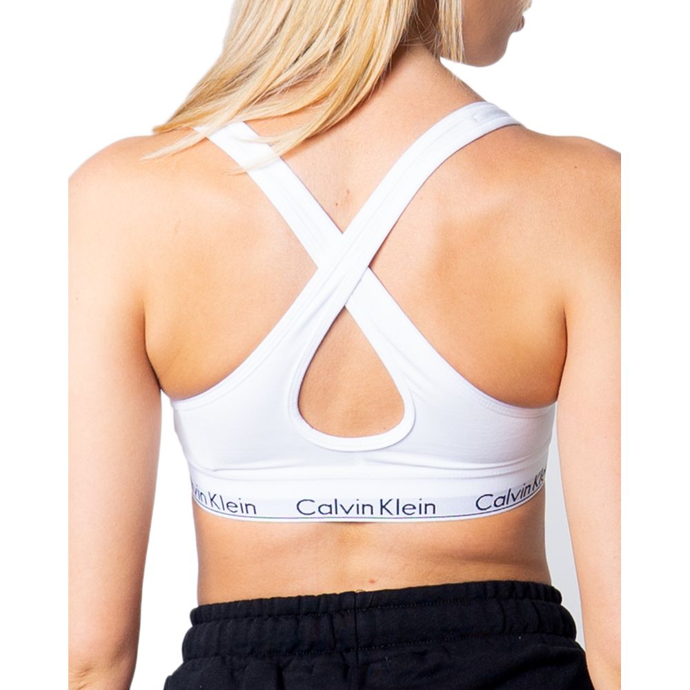 White Polyester BraDiscover the Lift bralette by Calvin Klein Underwear, an essential piece for your intimate wardrobe. Made from 100% polyester, this bra is designed to provide comfort and support throughout the day. Its bralette shape is perfect for a c