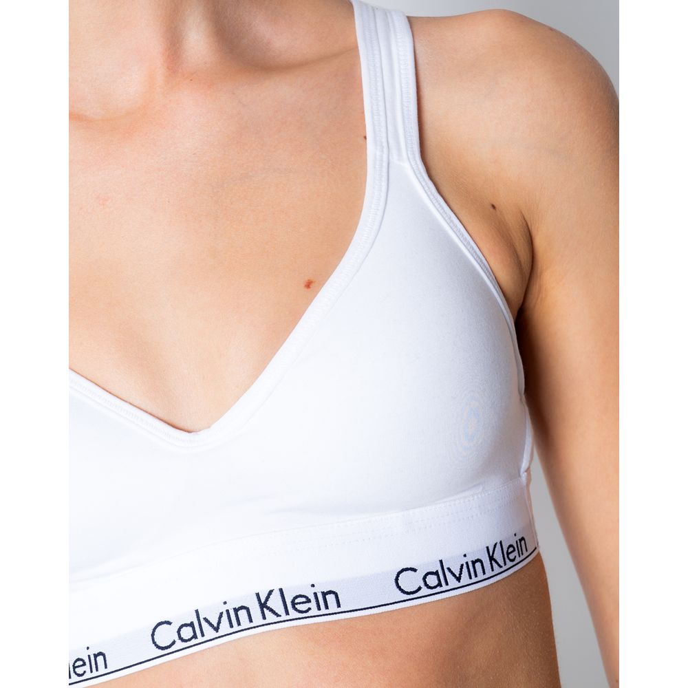 White Polyester BraDiscover the Lift bralette by Calvin Klein Underwear, an essential piece for your intimate wardrobe. Made from 100% polyester, this bra is designed to provide comfort and support throughout the day. Its bralette shape is perfect for a c