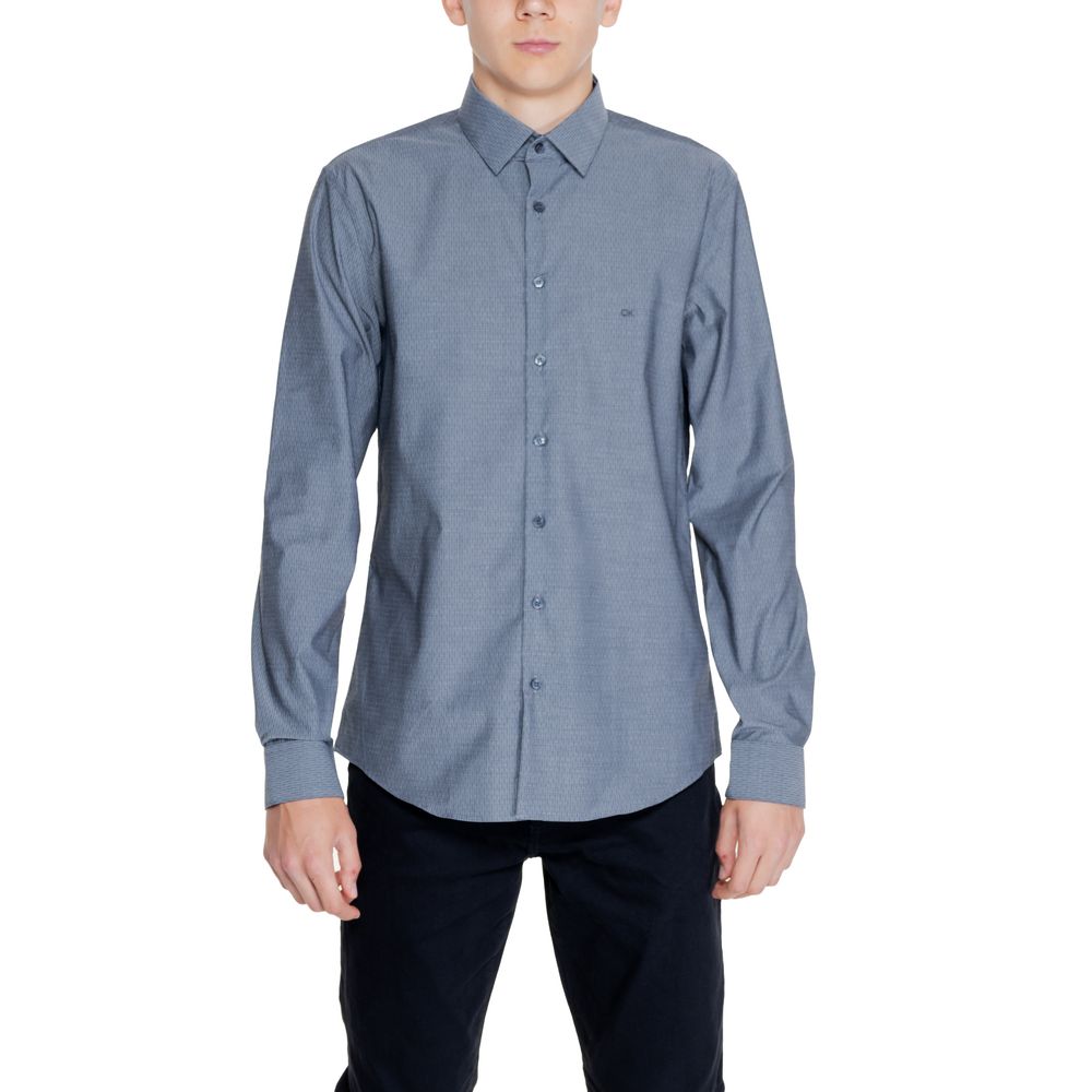 Black Cotton ShirtThe Calvin Klein DOBBY NON IRON K10K113165 men’s long-sleeve shirt combines elegance and practicality in a modern, refined garment. Made from 96% cotton and 4% elastane/lycra, this shirt provides a comfortable fit with slight stretch tha
