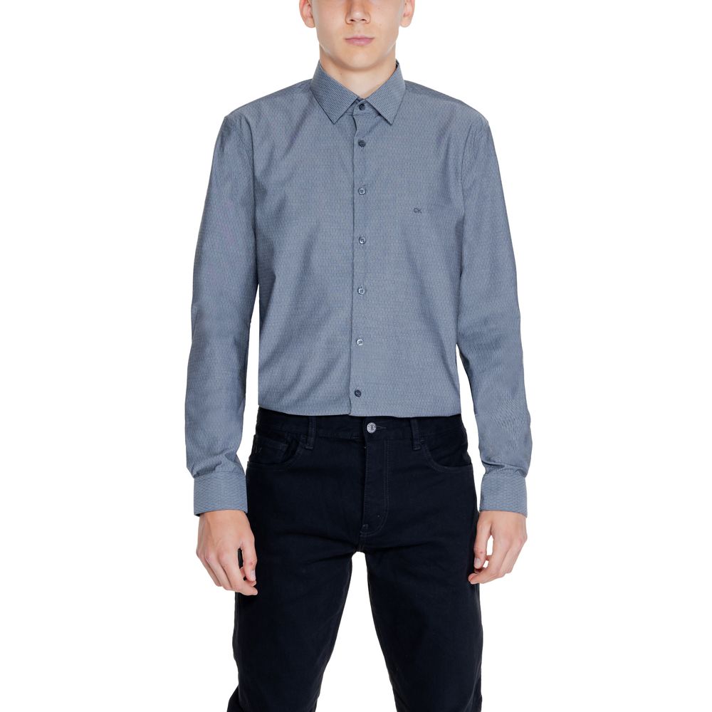 Black Cotton ShirtThe Calvin Klein DOBBY NON IRON K10K113165 men’s long-sleeve shirt combines elegance and practicality in a modern, refined garment. Made from 96% cotton and 4% elastane/lycra, this shirt provides a comfortable fit with slight stretch tha