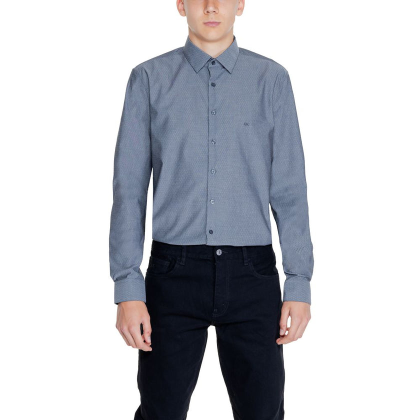 Black Cotton ShirtThe Calvin Klein DOBBY NON IRON K10K113165 men’s long-sleeve shirt combines elegance and practicality in a modern, refined garment. Made from 96% cotton and 4% elastane/lycra, this shirt provides a comfortable fit with slight stretch tha