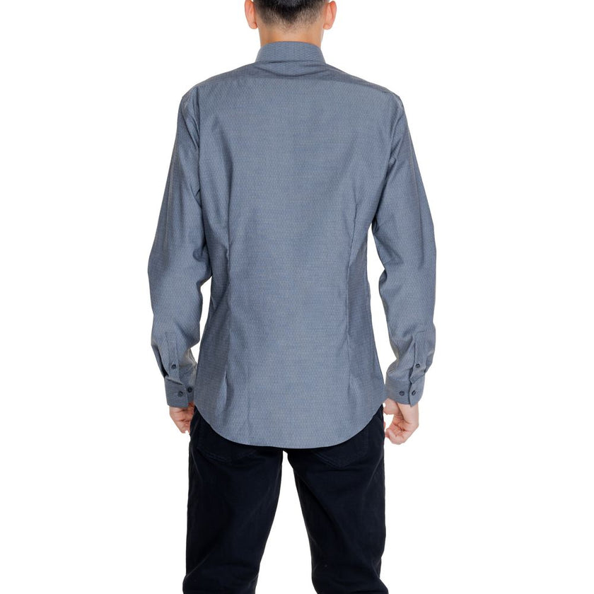 Black Cotton ShirtThe Calvin Klein DOBBY NON IRON K10K113165 men’s long-sleeve shirt combines elegance and practicality in a modern, refined garment. Made from 96% cotton and 4% elastane/lycra, this shirt provides a comfortable fit with slight stretch tha