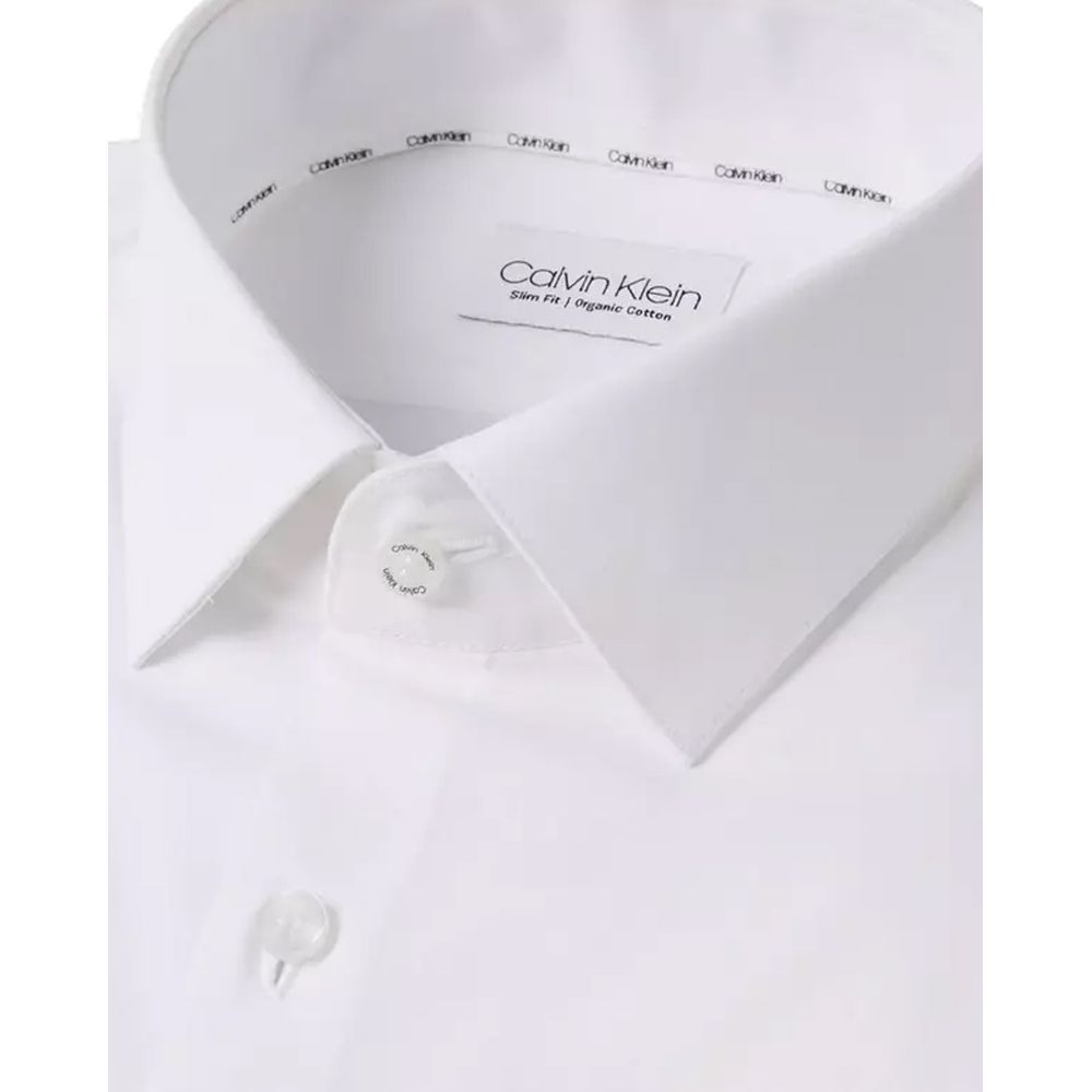 White Cotton Dress ShirtDiscover the Calvin Klein K10K108229 long-sleeve shirt for men, crafted from stretch poplin for a slim fit that accentuates the male silhouette. This shirt is made from 100% high-quality cotton, ensuring comfort and breathability t