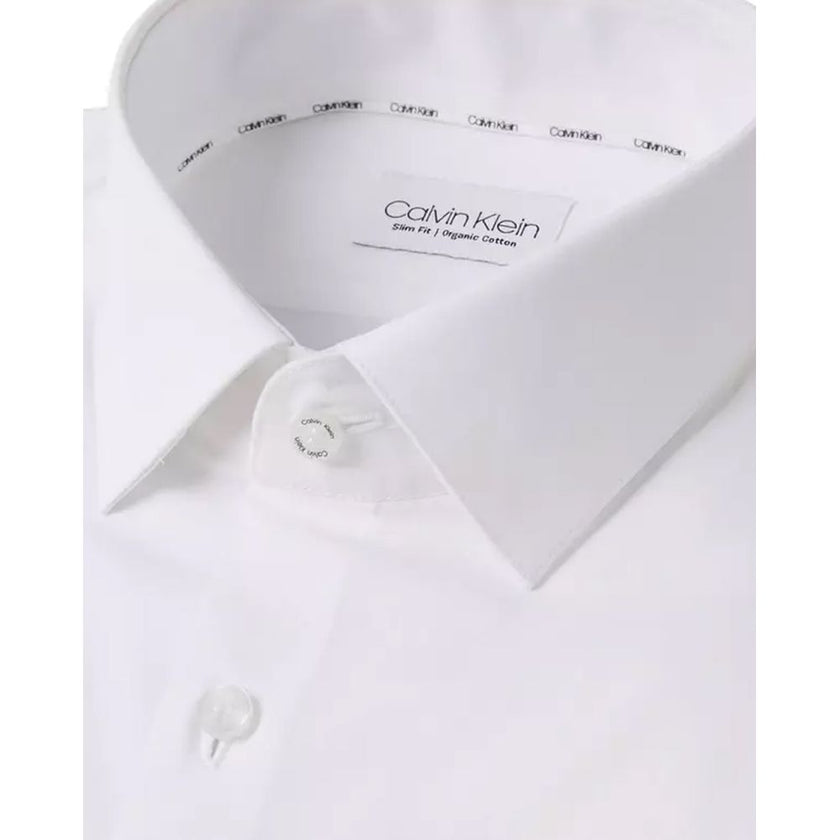 White Cotton Dress ShirtDiscover the Calvin Klein K10K108229 long-sleeve shirt for men, crafted from stretch poplin for a slim fit that accentuates the male silhouette. This shirt is made from 100% high-quality cotton, ensuring comfort and breathability t