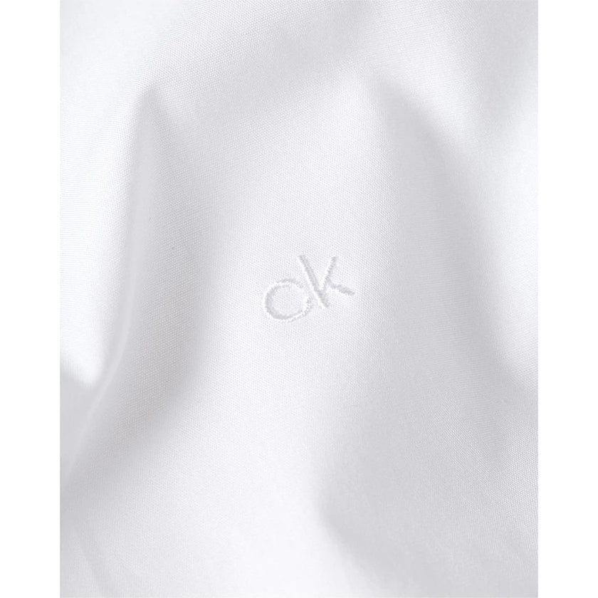 White Cotton Dress ShirtDiscover the Calvin Klein K10K108229 long-sleeve shirt for men, crafted from stretch poplin for a slim fit that accentuates the male silhouette. This shirt is made from 100% high-quality cotton, ensuring comfort and breathability t