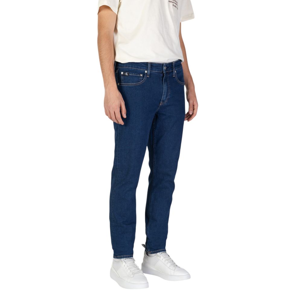 Blue Cotton Slim Fit JeansThe Calvin Klein Jeans TAPER J30J325888 men’s tapered jeans offer a perfect blend of contemporary style and comfort. Crafted from a sustainable fabric mix featuring 70% cotton, 20% recycled cotton, 8% polyester, and 2% elastane/l
