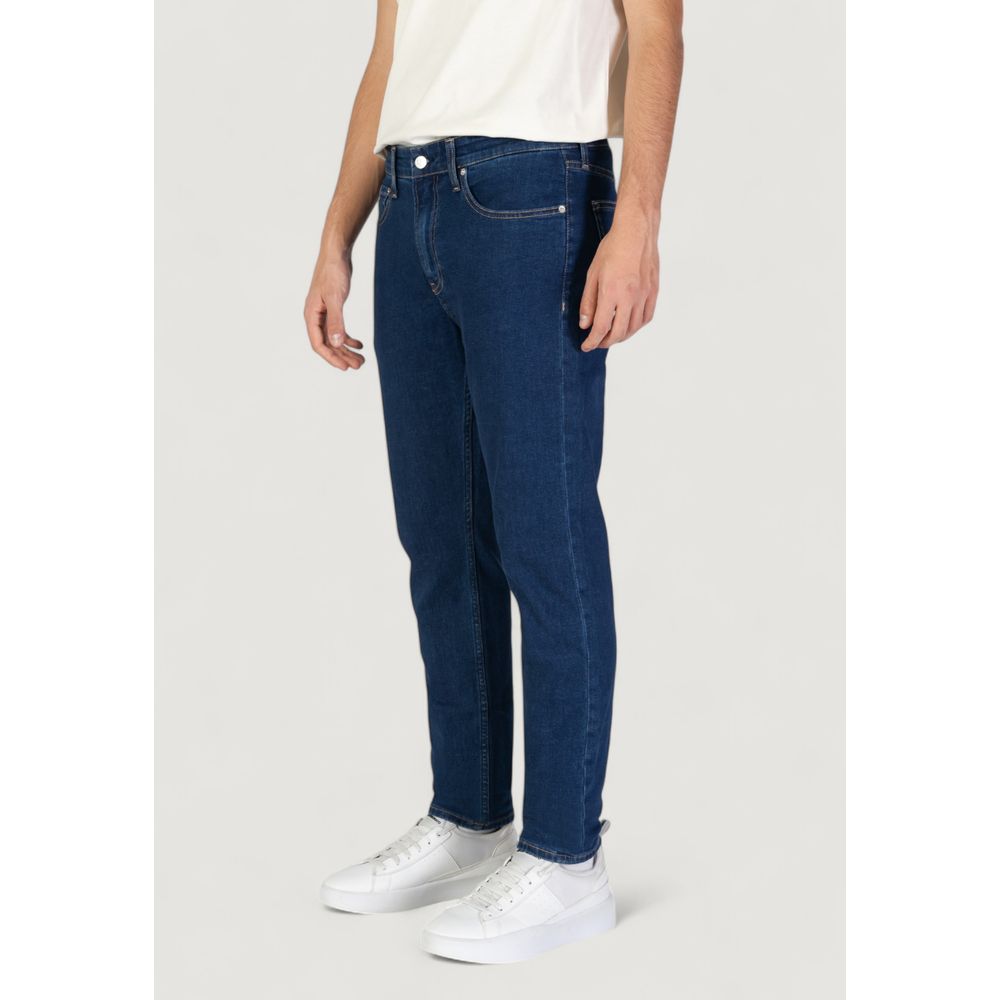 Blue Cotton Slim Fit JeansThe Calvin Klein Jeans TAPER J30J325888 men’s tapered jeans offer a perfect blend of contemporary style and comfort. Crafted from a sustainable fabric mix featuring 70% cotton, 20% recycled cotton, 8% polyester, and 2% elastane/l