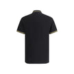 Black Cotton Polo ShirtCotton Polo Shirt by Versace, classic ribbed collar, tone-on-tone front buttons, iconic brand logo patch applied on front, regular fit. Season: AW25 Composition: 100% Cotton MADE IN TUNISIABlack Cotton Polo Shirt${tagsVersaceAulae B