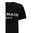 Black Cotton T-ShirtBalmain’s cotton T-Shirt combines the minimalism of a monochrome pattern with the elegance of the Maison’s iconic details. Made of soft cotton, it features a ribbed crew neck and a regular fit designed for everyday comfort. The design