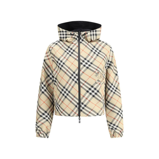 Brown Polyester Shell JacketBurberry’s reversible Jacket is a short, versatile style with an adjustable drawstring hood. The double-slider front zipper allows for convenient closure, while zippered side welt pockets offer functionality. Elasticized cuffs