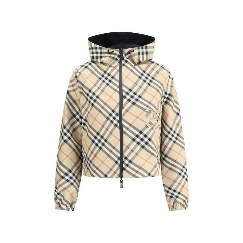 Brown Polyester Shell JacketBurberry’s reversible Jacket is a short, versatile style with an adjustable drawstring hood. The double-slider front zipper allows for convenient closure, while zippered side welt pockets offer functionality. Elasticized cuffs