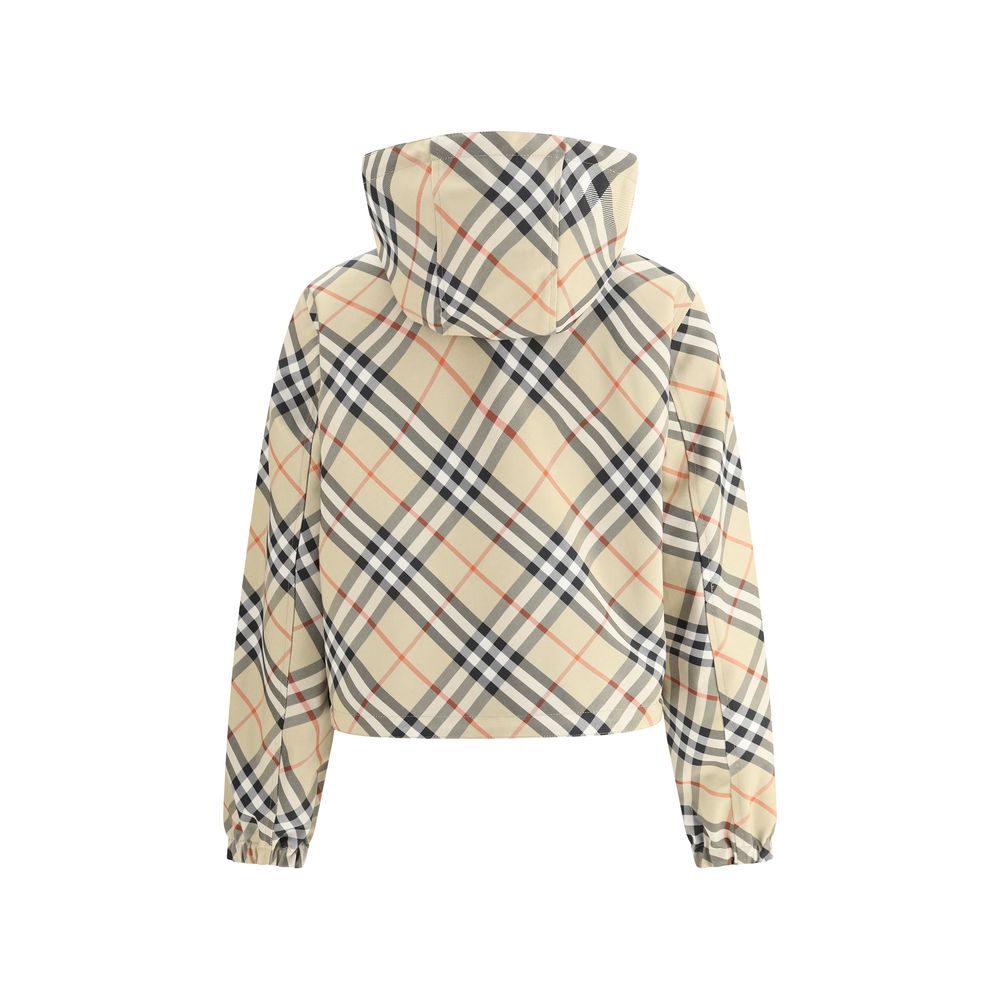 Brown Polyester Shell JacketBurberry’s reversible Jacket is a short, versatile style with an adjustable drawstring hood. The double-slider front zipper allows for convenient closure, while zippered side welt pockets offer functionality. Elasticized cuffs
