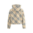 Brown Polyester Shell JacketBurberry’s reversible Jacket is a short, versatile style with an adjustable drawstring hood. The double-slider front zipper allows for convenient closure, while zippered side welt pockets offer functionality. Elasticized cuffs