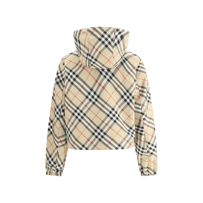 Brown Polyester Shell JacketBurberry’s reversible Jacket is a short, versatile style with an adjustable drawstring hood. The double-slider front zipper allows for convenient closure, while zippered side welt pockets offer functionality. Elasticized cuffs