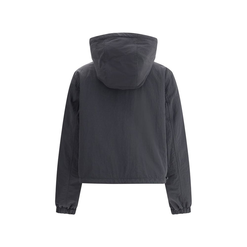 Brown Polyester Shell JacketBurberry’s reversible Jacket is a short, versatile style with an adjustable drawstring hood. The double-slider front zipper allows for convenient closure, while zippered side welt pockets offer functionality. Elasticized cuffs