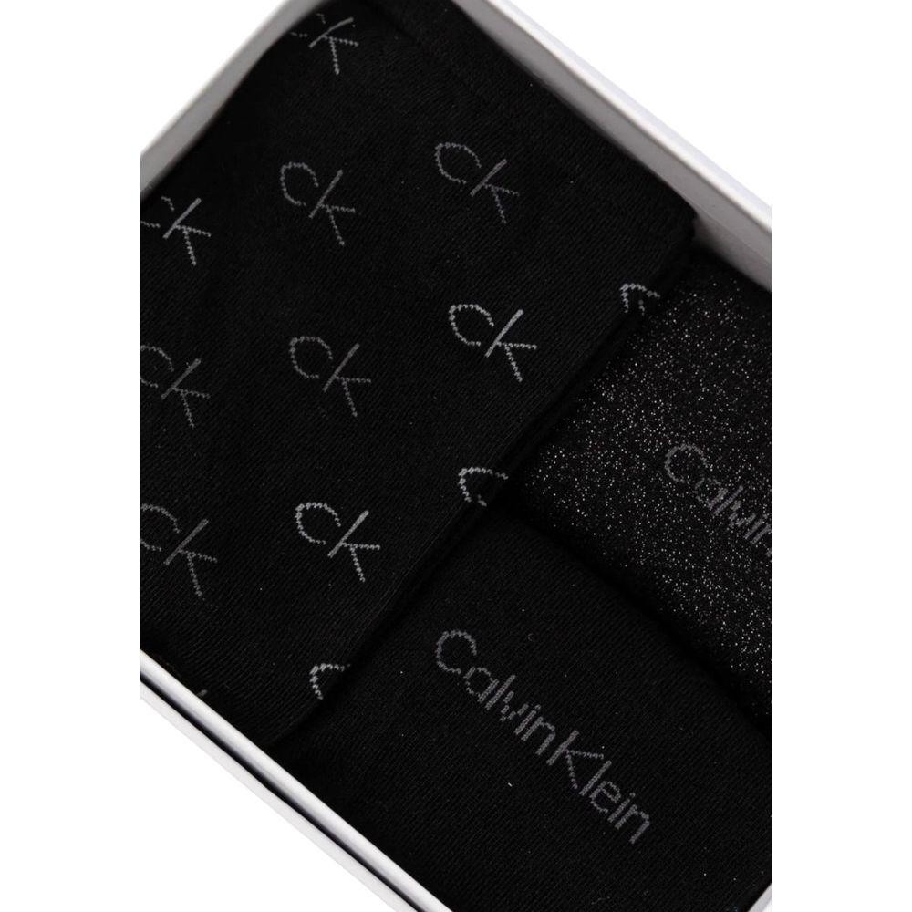 Black Cotton SocksDiscover the elegance and comfort of the Calvin Klein SOCK 3P LUREX LOGO GI 701229444 women’s socks. Made with high-quality materials, these socks are composed of 49% cotton, 42% polyamide, 7% metallic fibers, and 2% elastane/lycra, ensu