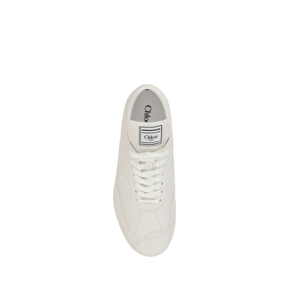 White Calf Leather Bos Taurus Low Top SneakersChloé’s Leather Kick Sneakers combine elegance and practicality in a modern, versatile design. With a flat sole, these sneakers offer all-day comfort and support. The front lace-up closure allows for an adjust