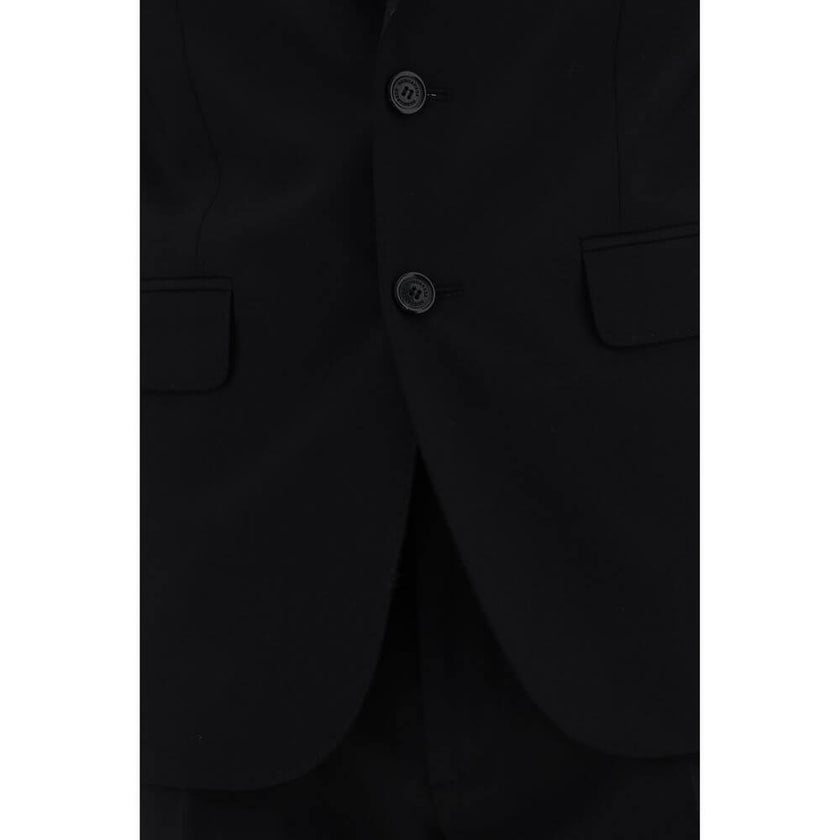 Blue Fleece Wool Two-Piece SuitThe Dsquared2 virgin wool Suit, consisting of a jacket and trousers, is a timeless classic revisited with the brand’s distinctive style. The blazer jacket, made of pure wool, features a front closure with matching buttons, c
