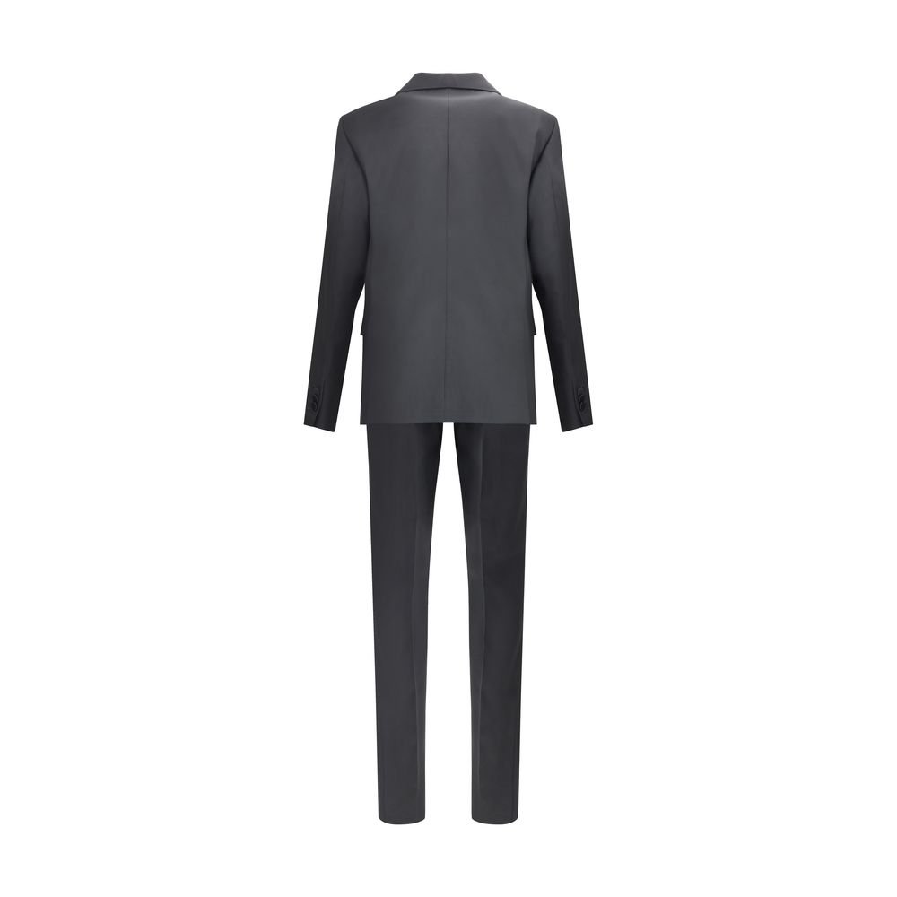 Black Fleece Wool Two-Piece SuitThe London virgin wool Suit by Dsquared2 is a tailored proposal with an impeccable cut and refined style. The blazer jacket, made of pure wool, features a single button front closure, peak lapels, two flap welt pockets on t
