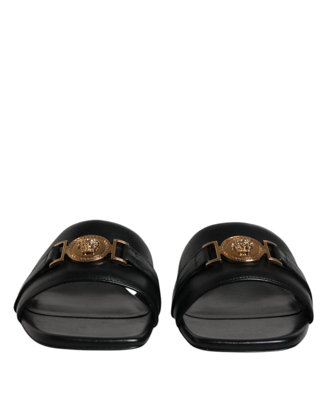 Black Leather Logo Plaque Slip On Slides Flats ShoesVERSACE Gorgeous brand new with tags, 100% Authentic VERSACE black leather logo plaque open toe slip-on style. Model: Slides slip on sandals Color: Black with gold metal detailing Material: 100% Leather