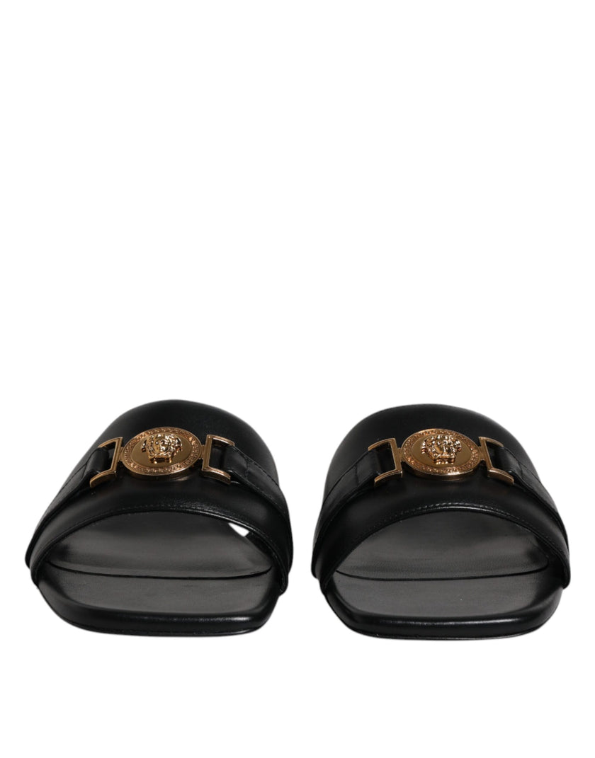 Black Leather Logo Plaque Slip On Slides Flats ShoesVERSACE Gorgeous brand new with tags, 100% Authentic VERSACE black leather logo plaque open toe slip-on style. Model: Slides slip on sandals Color: Black with gold metal detailing Material: 100% Leather