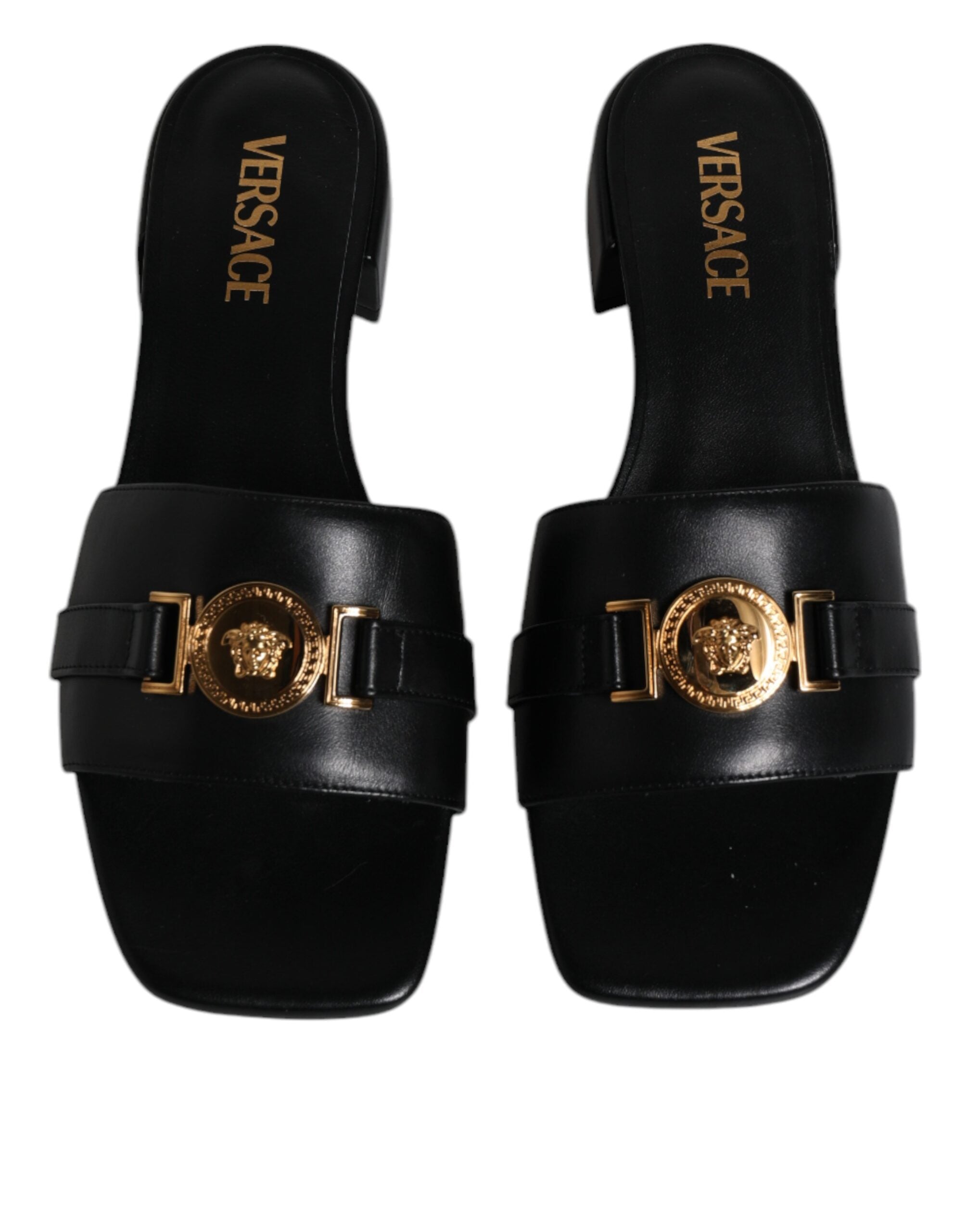 Black Leather Logo Plaque Slip On Slides Flats ShoesVERSACE Gorgeous brand new with tags, 100% Authentic VERSACE black leather logo plaque open toe slip-on style. Model: Slides slip on sandals Color: Black with gold metal detailing Material: 100% Leather