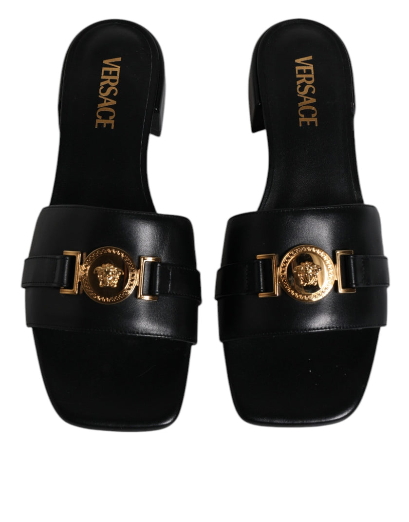 Black Leather Logo Plaque Slip On Slides Flats ShoesVERSACE Gorgeous brand new with tags, 100% Authentic VERSACE black leather logo plaque open toe slip-on style. Model: Slides slip on sandals Color: Black with gold metal detailing Material: 100% Leather