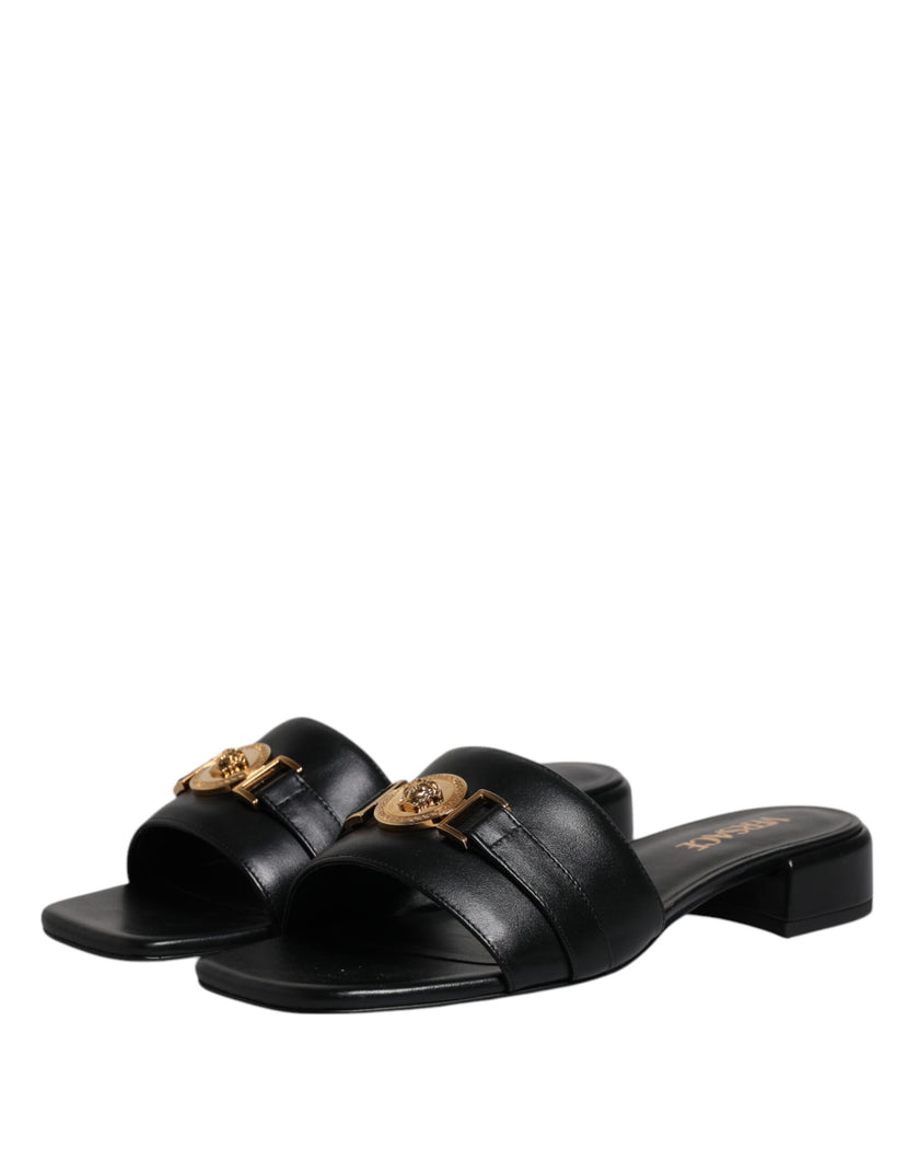 Black Leather Logo Plaque Slip On Slides Flats ShoesVERSACE Gorgeous brand new with tags, 100% Authentic VERSACE black leather logo plaque open toe slip-on style. Model: Slides slip on sandals Color: Black with gold metal detailing Material: 100% Leather