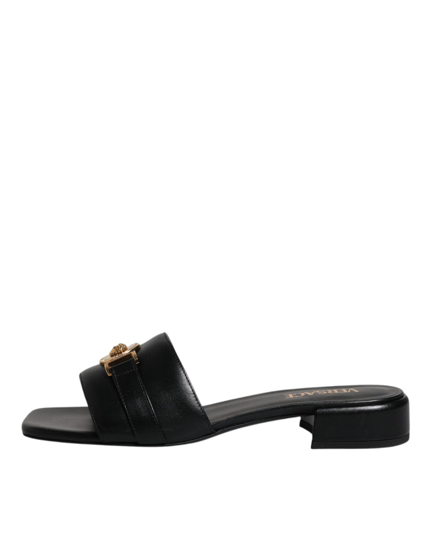 Black Leather Logo Plaque Slip On Slides Flats ShoesVERSACE Gorgeous brand new with tags, 100% Authentic VERSACE black leather logo plaque open toe slip-on style. Model: Slides slip on sandals Color: Black with gold metal detailing Material: 100% Leather
