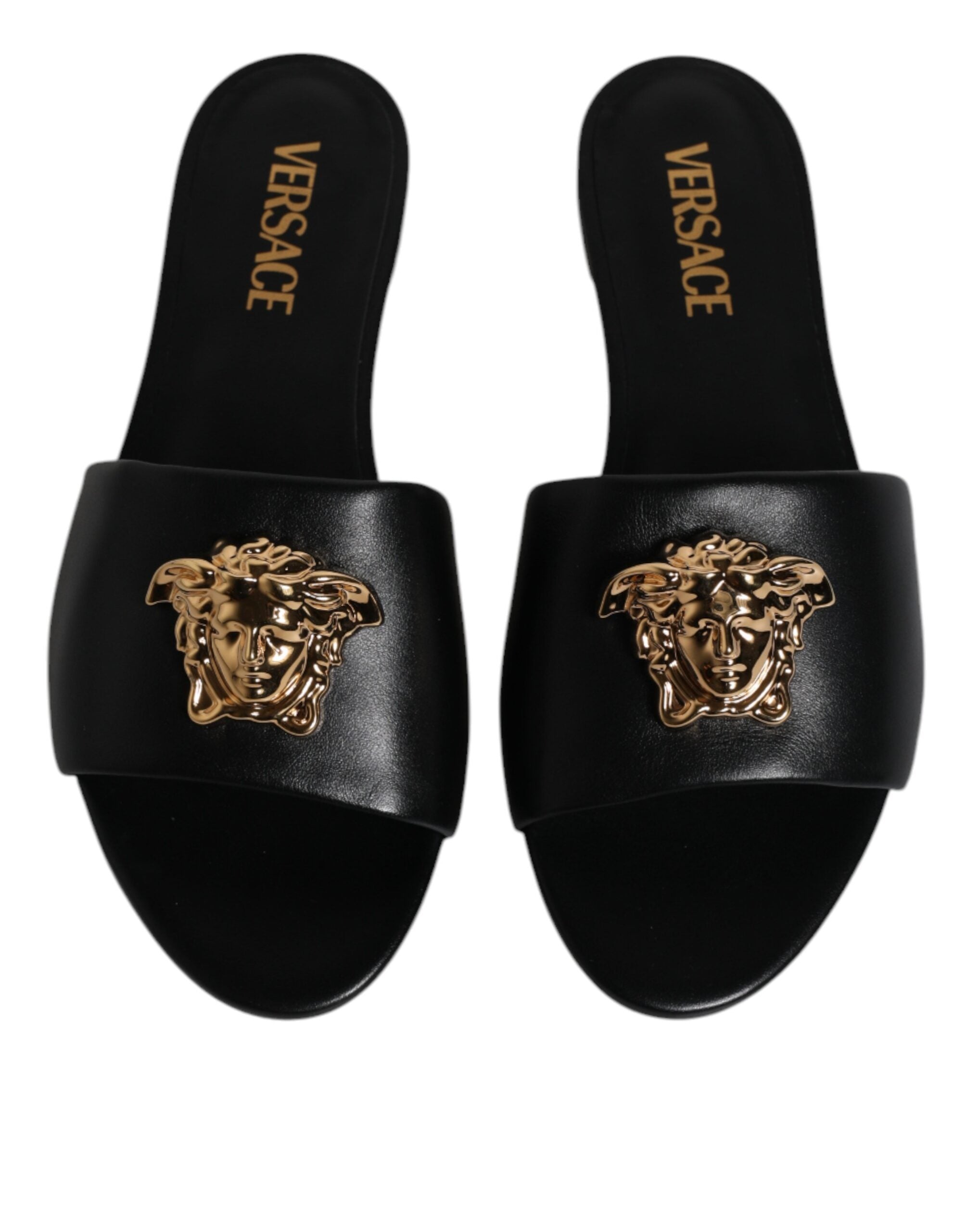 Black Leather Logo Plaque Slip On Slides Flats ShoesVERSACE Gorgeous brand new with tags, 100% Authentic VERSACE black leather logo plaque open toe slip-on style. Model: Slides slip on sandals Color: Black with gold metal detailing Material: 100% Leather