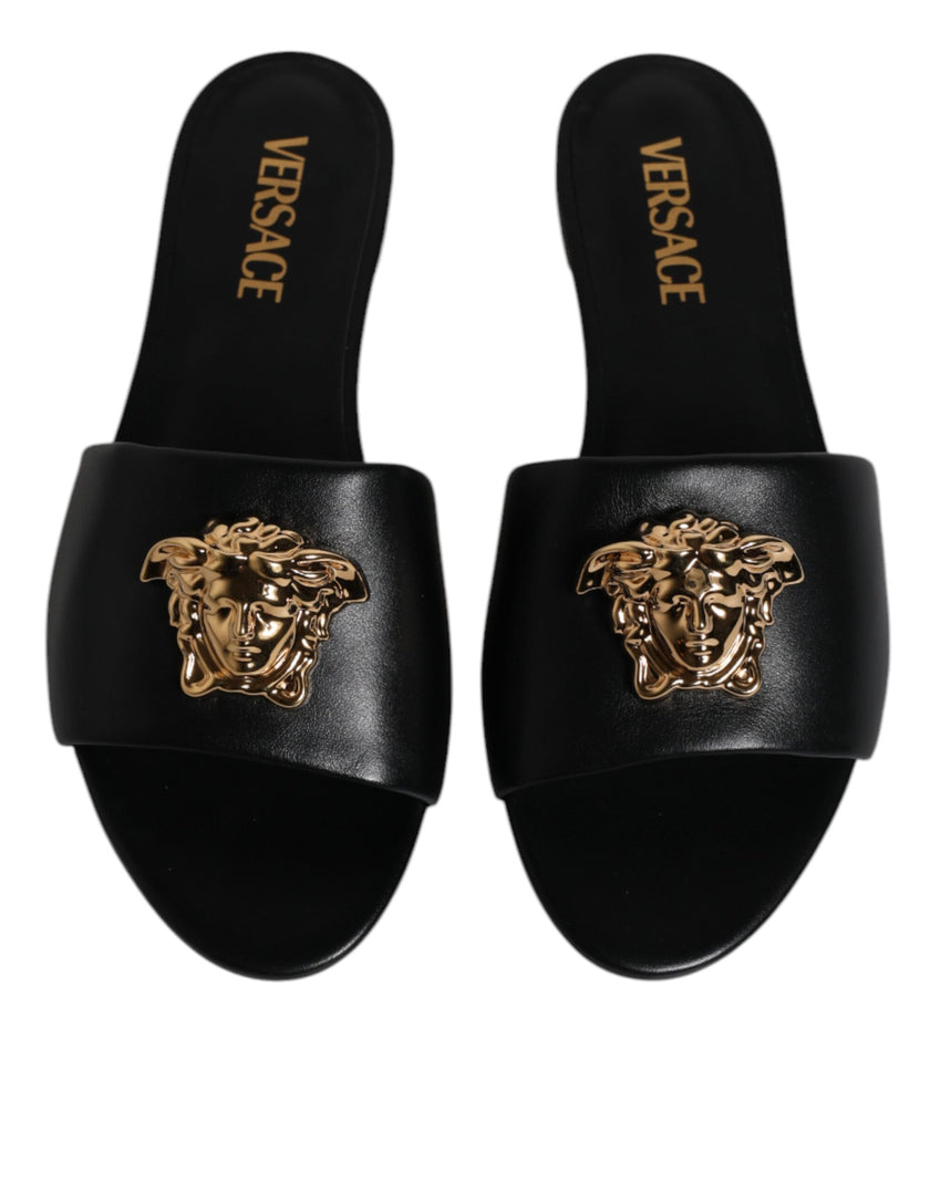 Black Leather Logo Plaque Slip On Slides Flats ShoesVERSACE Gorgeous brand new with tags, 100% Authentic VERSACE black leather logo plaque open toe slip-on style. Model: Slides slip on sandals Color: Black with gold metal detailing Material: 100% Leather