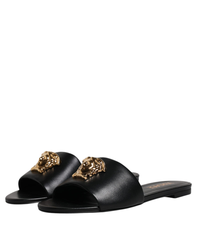 Black Leather Logo Plaque Slip On Slides Flats ShoesVERSACE Gorgeous brand new with tags, 100% Authentic VERSACE black leather logo plaque open toe slip-on style. Model: Slides slip on sandals Color: Black with gold metal detailing Material: 100% Leather