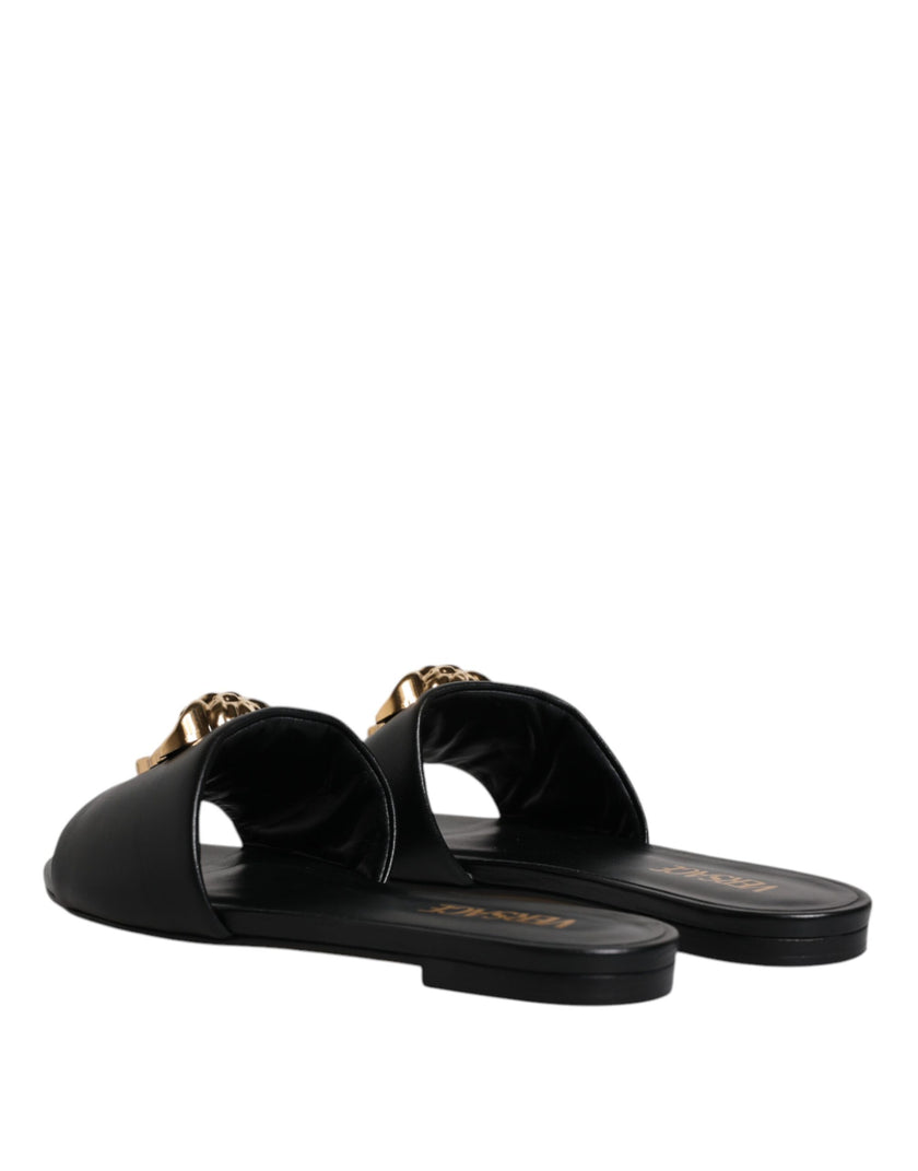 Black Leather Logo Plaque Slip On Slides Flats ShoesVERSACE Gorgeous brand new with tags, 100% Authentic VERSACE black leather logo plaque open toe slip-on style. Model: Slides slip on sandals Color: Black with gold metal detailing Material: 100% Leather