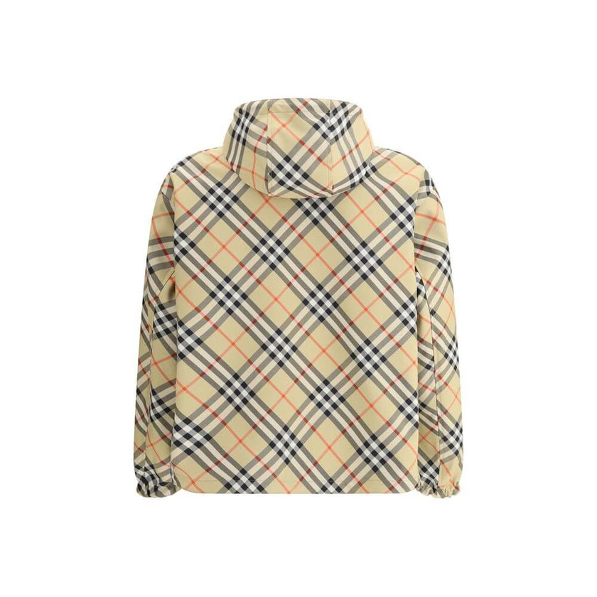 Reversible waterproof JacketBurberry’s reversible Waterproof Jacket is a versatile and functional garment perfect for any occasion. Featuring an adjustable drawstring hood and a front zipper closure, it offers practicality and protection. The two side wel